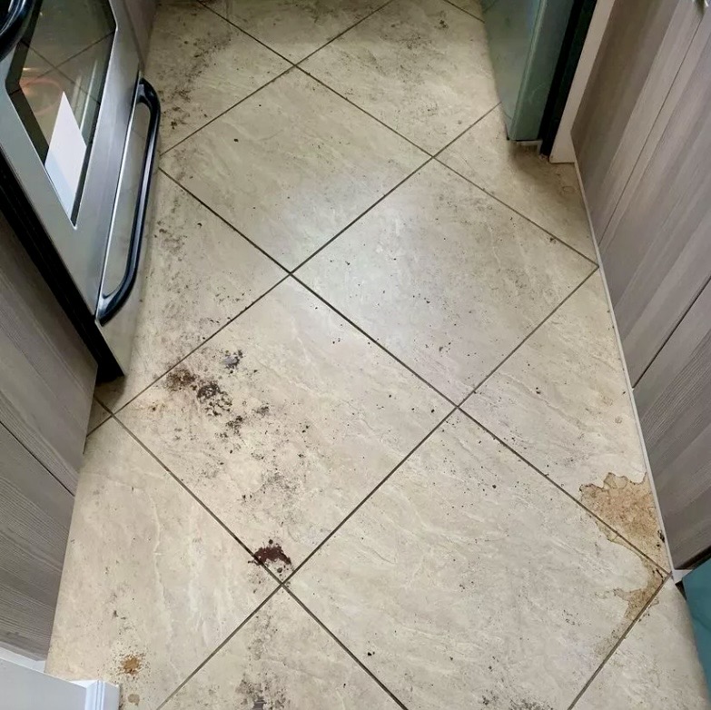 Kitchen tile floor before deep cleaning