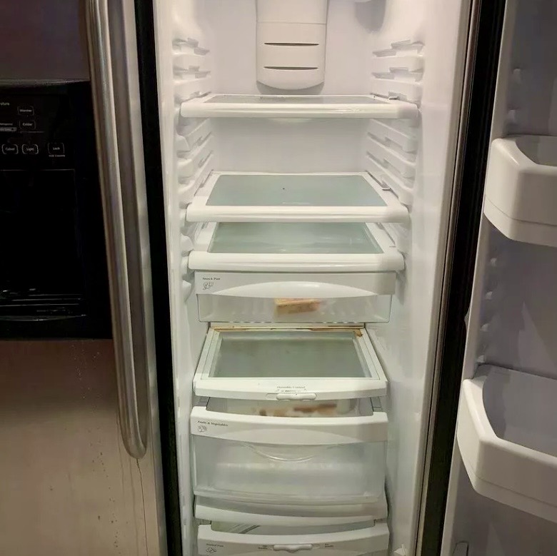 Refrigerator interior before detailed cleaning